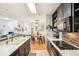 Open kitchen view showcasing the dining area with a pendant light and modern cabinetry at 9481 Highland Oak Dr # 1616, Tampa, FL 33647