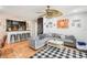Open-concept living space featuring comfortable seating, a breakfast bar, and modern decor at 9481 Highland Oak Dr # 1616, Tampa, FL 33647