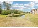 Picturesque pond view surrounded by lush greenery and trees, a tranquil setting at 9481 Highland Oak Dr # 1616, Tampa, FL 33647