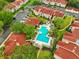 Inviting community pool with lounge chairs and palm trees, perfect for summer relaxation at 9481 Highland Oak Dr # 1616, Tampa, FL 33647