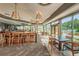 Restaurant dining room offering large windows and tables with comfortable seating, and bar at 9481 Highland Oak Dr # 1616, Tampa, FL 33647