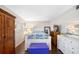 This bedroom has wood floors, lots of furniture, and a nice mirror at 1000 79Th N Ave # 211, St Petersburg, FL 33702