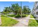 Community sidewalks wind through well-maintained landscaping at 1000 79Th N Ave # 211, St Petersburg, FL 33702