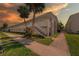 Condominium complex features well-kept grounds, palm trees, and exterior staircases at 1000 79Th N Ave # 211, St Petersburg, FL 33702