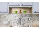 Modern kitchen sink features stainless steel appliances and a stylish backsplash at 1000 79Th N Ave # 211, St Petersburg, FL 33702