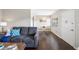 The inviting living room has a dining area with a round table and features a plush gray couch at 1000 79Th N Ave # 211, St Petersburg, FL 33702