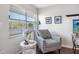 Cozy living room featuring a large window and comfortable chair at 1000 79Th N Ave # 211, St Petersburg, FL 33702