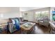 Comfortable living room with a sofa, armchair, and modern decor at 1000 79Th N Ave # 211, St Petersburg, FL 33702