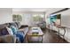 Comfortable living room with a sofa, coffee table, and TV at 1000 79Th N Ave # 211, St Petersburg, FL 33702