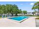 Outdoor pool with surrounding lounge chairs and manicured lawns at 1000 79Th N Ave # 211, St Petersburg, FL 33702