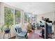 This sun room has great light, plants, and a place to work at 1000 79Th N Ave # 211, St Petersburg, FL 33702
