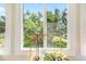 This window overlooks well-maintained lawns and mature landscaping at 1000 79Th N Ave # 211, St Petersburg, FL 33702