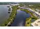 Scenic overhead view of condos nestled amidst a lush landscape and tranquil waterway at 10035 63Rd N Ave # 23, St Petersburg, FL 33708