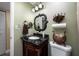 Stylish bathroom features granite countertop vanity, decorative mirror, and coordinated fixtures at 10035 63Rd N Ave # 23, St Petersburg, FL 33708