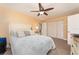 Bedroom featuring a ceiling fan, large closet, neutral walls, and carpet flooring for a relaxing atmosphere at 10035 63Rd N Ave # 23, St Petersburg, FL 33708
