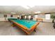 Large recreation room featuring pool tables, foosball, and ping pong great for entertaining at 10035 63Rd N Ave # 23, St Petersburg, FL 33708