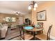 Cozy dining area with a round table, seating for four, and seamlessly connected to the living room at 10035 63Rd N Ave # 23, St Petersburg, FL 33708