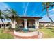 Community clubhouse featuring a beautiful fountain with detailed ceramic border and statue at 10035 63Rd N Ave # 23, St Petersburg, FL 33708