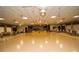 Spacious open community hall complete with decorations, stage, and tables and chairs at 10035 63Rd N Ave # 23, St Petersburg, FL 33708