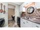 Galley kitchen featuring white cabinets, stainless steel appliances, granite countertops and a mosaic tile backsplash at 10035 63Rd N Ave # 23, St Petersburg, FL 33708
