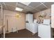 Practical laundry room with multiple washer and dryer units for efficient laundry tasks at 10035 63Rd N Ave # 23, St Petersburg, FL 33708