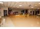View of the community hall stage complete with grand piano and decorations at 10035 63Rd N Ave # 23, St Petersburg, FL 33708