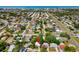 An aerial shot showcasing the property within a lovely neighborhood close to the coast and other local amenities at 10074 Bahama Ct, Seminole, FL 33776