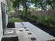 Well-maintained backyard with outdoor shower and beautifully landscaped area at 10074 Bahama Ct, Seminole, FL 33776