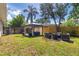 Expansive backyard with a gazebo and outdoor seating at 10074 Bahama Ct, Seminole, FL 33776