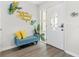 Tastefully decorated entryway with charming decor, comfortable seating, and an elegant door at 10074 Bahama Ct, Seminole, FL 33776