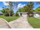 Well-maintained single-story home featuring a manicured lawn, clean lines, and a paved driveway in a great neighborhood at 10074 Bahama Ct, Seminole, FL 33776