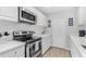 Well-equipped kitchen with stainless steel appliances, ample cabinet space, and a modern design at 10074 Bahama Ct, Seminole, FL 33776