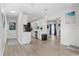 Open-concept kitchen and living area with sleek countertops and great flow for entertaining at 10074 Bahama Ct, Seminole, FL 33776