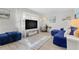 Bright living room featuring modern furnishings, a large window with sheer curtains, and stylish decor at 10074 Bahama Ct, Seminole, FL 33776
