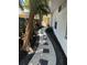 Pathway featuring decorative stone with stepping pavers in landscaped side yard at 10074 Bahama Ct, Seminole, FL 33776