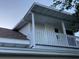 Home exterior features a balcony with white railing and neutral exterior paint at 1107 S Prospect Ave, Clearwater, FL 33756