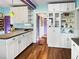 Well-lit kitchen with white cabinetry, sleek countertops, and modern appliances at 1107 S Prospect Ave, Clearwater, FL 33756
