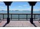 Beautiful water view from a wooden deck, with the city skyline and bridge visible in the distance at 1107 S Prospect Ave, Clearwater, FL 33756