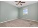 Bedroom featuring a light blue-green color scheme, ceiling fan, and single window at 11638 Woodleaf Dr, Bradenton, FL 34211