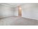 Spacious bedroom with plush carpeting leading to walk in closet at 11638 Woodleaf Dr, Bradenton, FL 34211