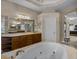 Relaxing bathroom offers a jacuzzi tub, generous counter space, and soft lighting at 13538 Thoroughbred Dr, Dade City, FL 33525
