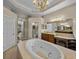 Bathroom boasts jacuzzi tub, spacious vanity area, and neutral color palette at 13538 Thoroughbred Dr, Dade City, FL 33525