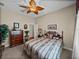 Charming bedroom with a ceiling fan, dark furniture, light walls and a comfortable feel at 13538 Thoroughbred Dr, Dade City, FL 33525