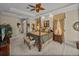 Bedroom showcases a four-poster bed, sitting area, and tray ceiling with fan at 13538 Thoroughbred Dr, Dade City, FL 33525