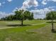 Expansive golf course view with mature trees and open fairway at 13538 Thoroughbred Dr, Dade City, FL 33525