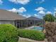 Enjoy this screened in pool with brick patio, perfect for outdoor entertaining at 13538 Thoroughbred Dr, Dade City, FL 33525