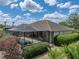A beautiful, private screened pool with brick patio in the backyard at 13538 Thoroughbred Dr, Dade City, FL 33525