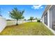 Well-maintained backyard with a white picket fence and views of the community at 13749 Hunting Creek Pl, Spring Hill, FL 34609