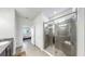 Modern bathroom featuring a glass-enclosed shower, granite vanity, and tile flooring at 13749 Hunting Creek Pl, Spring Hill, FL 34609