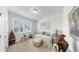 Cozy bedroom featuring bright light from the windows and neutral décor throughout at 13749 Hunting Creek Pl, Spring Hill, FL 34609
